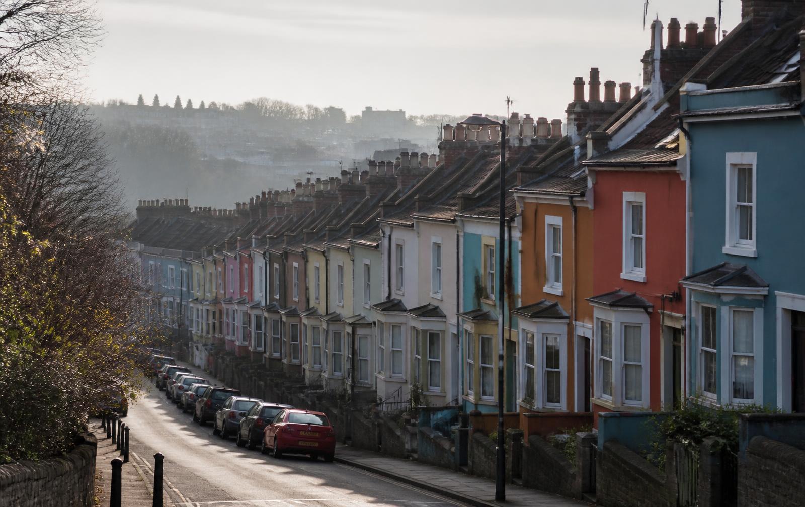 A row of British terraced houses on a Bristol street in morning light